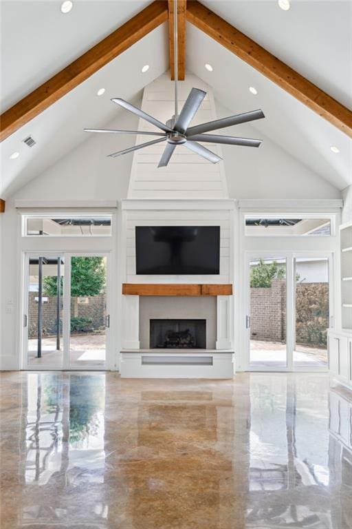 unfurnished living room with a large fireplace, ceiling fan, visible vents, and beamed ceiling