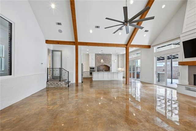 unfurnished living room featuring a large fireplace, visible vents, high vaulted ceiling, and ceiling fan