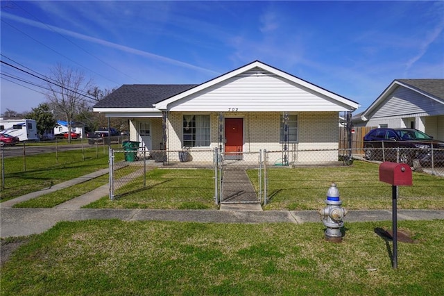 bungalow-style home featuring a porch, a fenced front yard, brick siding, a gate, and a front yard