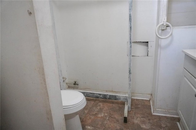 bathroom featuring toilet and vanity