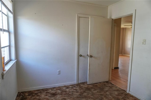 unfurnished bedroom featuring a closet and carpet