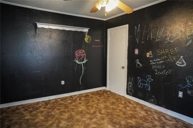 spare room with carpet flooring, crown molding, and ceiling fan