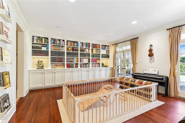 sitting room with ornamental molding, french doors, a healthy amount of sunlight, and dark wood finished floors