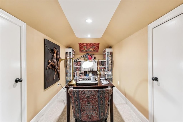 hallway featuring baseboards, recessed lighting, and carpet floors