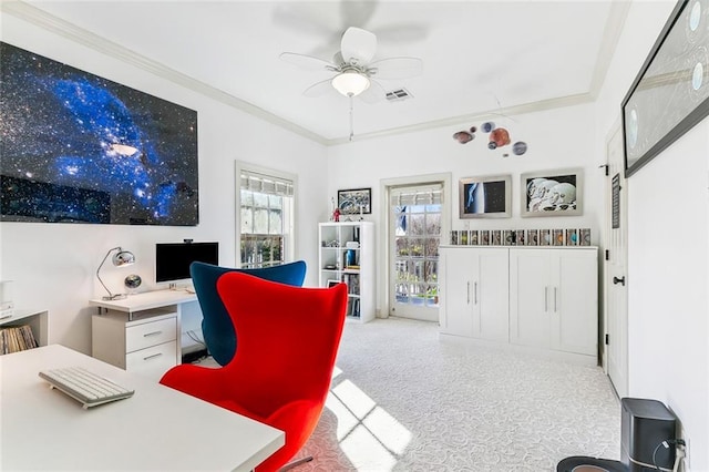 home office with carpet flooring, crown molding, visible vents, and a ceiling fan