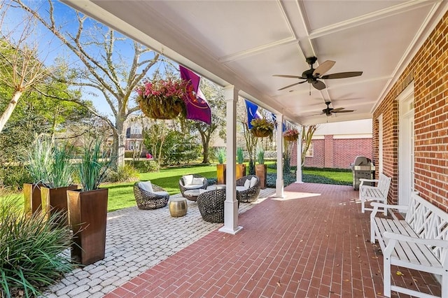 view of patio / terrace featuring ceiling fan, area for grilling, and an outdoor living space