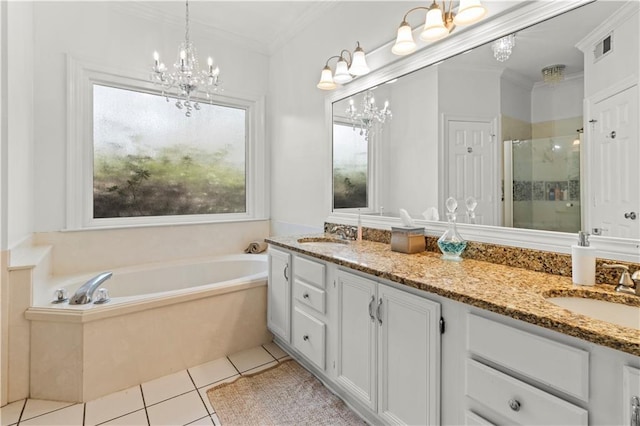 bathroom featuring crown molding, a sink, a shower stall, and tile patterned floors