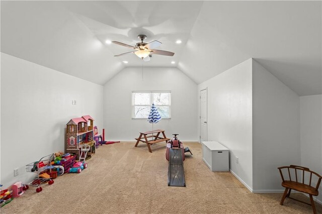 playroom with lofted ceiling, recessed lighting, light colored carpet, a ceiling fan, and baseboards