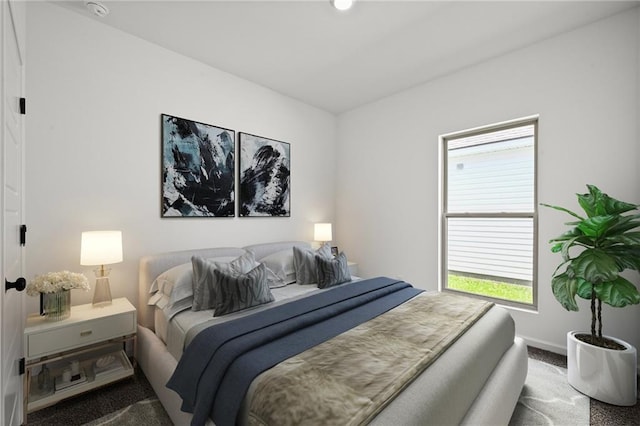 bedroom with carpet flooring and baseboards