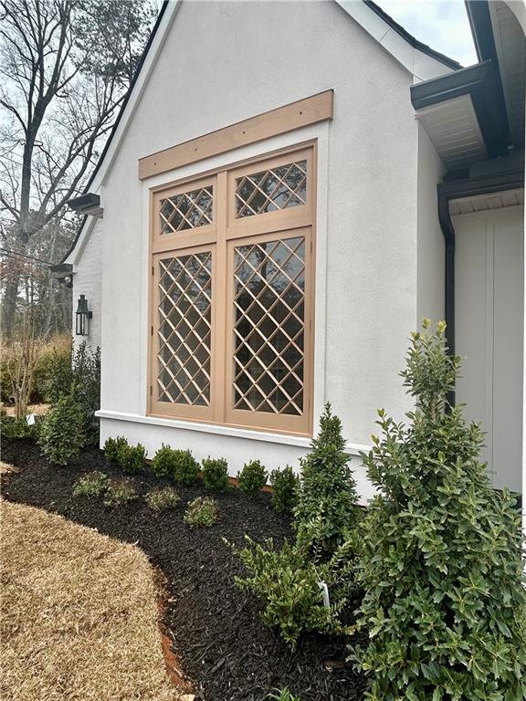 view of side of property featuring stucco siding