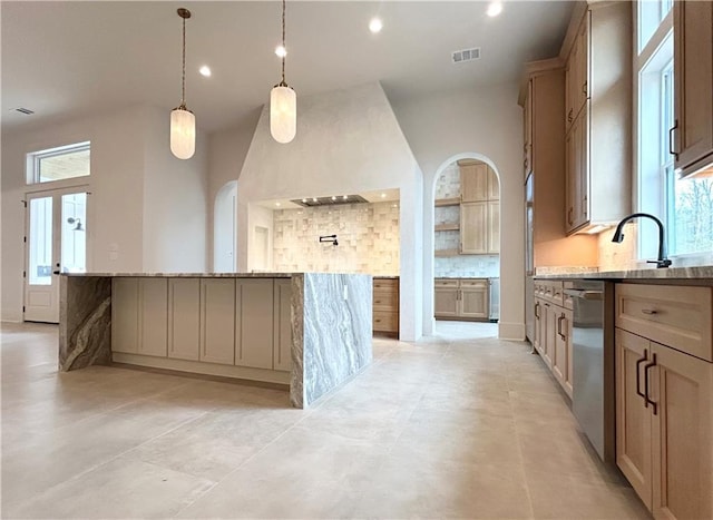 kitchen featuring recessed lighting, backsplash, dishwasher, and a center island