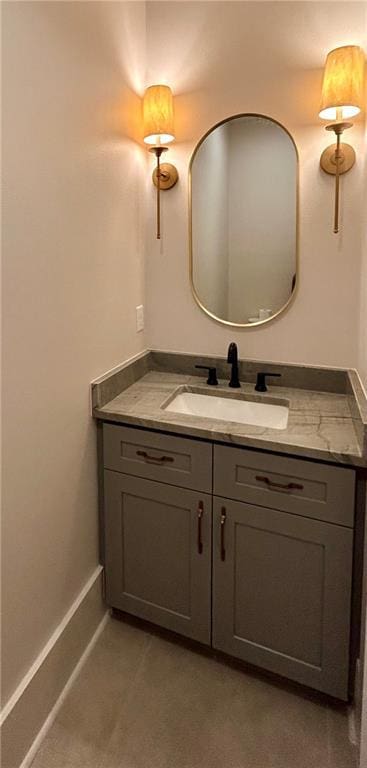 bathroom with baseboards and vanity