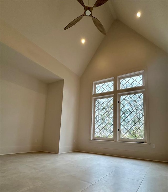 spare room with high vaulted ceiling, recessed lighting, baseboards, and a ceiling fan