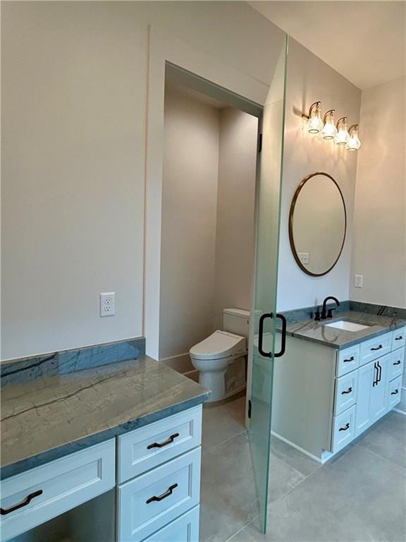 bathroom featuring toilet and vanity