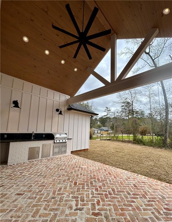 view of patio / terrace featuring a ceiling fan, a sink, grilling area, and area for grilling