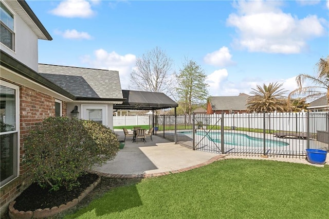 view of pool featuring a fenced in pool, a patio area, a lawn, and a fenced backyard