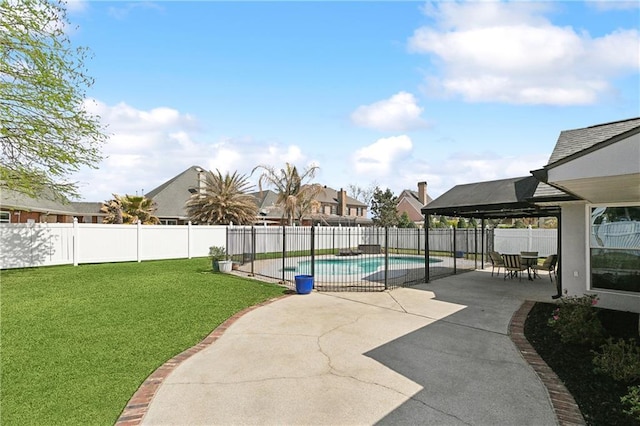 view of pool featuring a patio area, a fenced backyard, a fenced in pool, and a yard