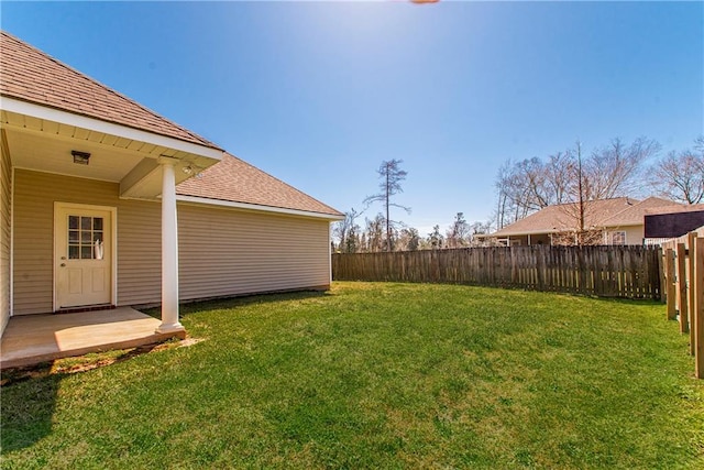 view of yard with a fenced backyard