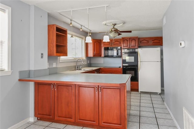 kitchen featuring light tile patterned floors, open shelves, visible vents, a peninsula, and black appliances