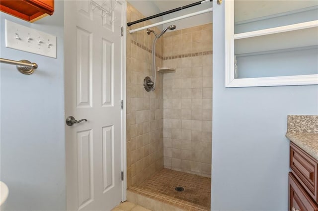 full bath featuring a stall shower and vanity