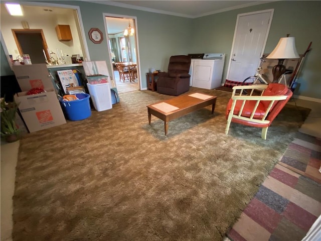 carpeted living room featuring baseboards, washer and dryer, and crown molding