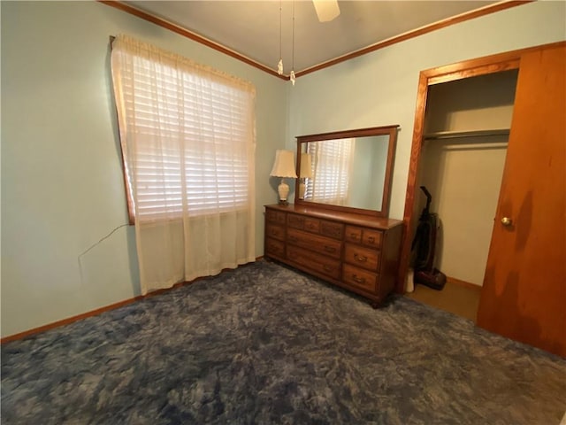 carpeted bedroom with a closet and a ceiling fan