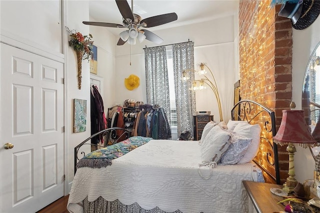 bedroom with ceiling fan and multiple windows