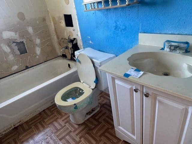 full bathroom featuring vanity, toilet, and a bathing tub