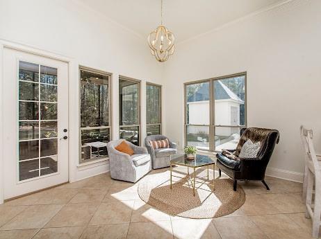 sunroom with a notable chandelier