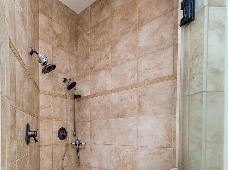 details featuring a tile shower