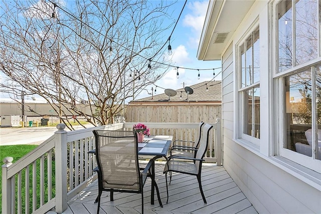 deck featuring outdoor dining area