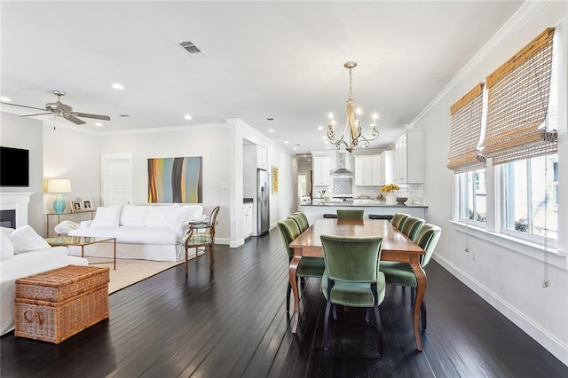 dining area with baseboards, visible vents, dark wood finished floors, and ornamental molding