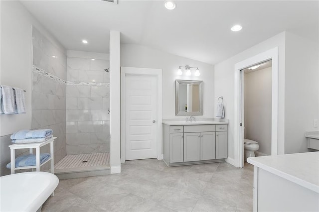 bathroom with recessed lighting, a soaking tub, tiled shower, and vanity