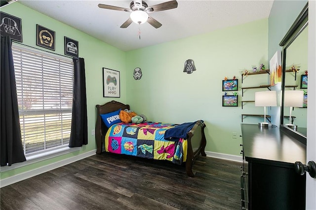 bedroom featuring ceiling fan, wood finished floors, and baseboards