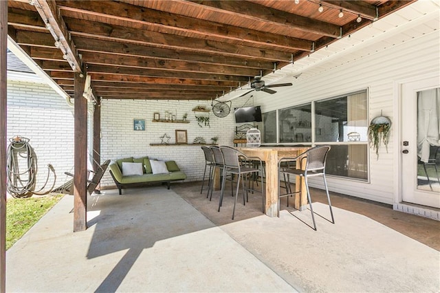 view of patio / terrace featuring a ceiling fan and outdoor dining space