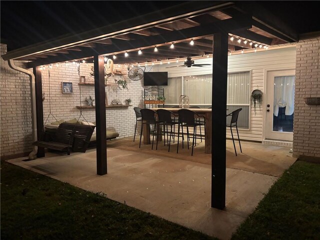 view of patio / terrace with a ceiling fan and a pergola