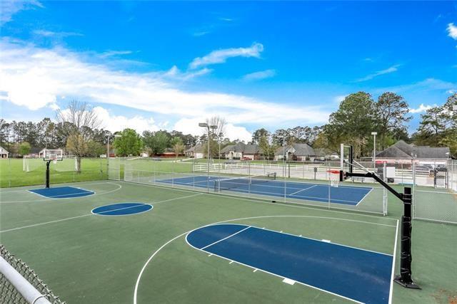 view of basketball court with community basketball court and fence