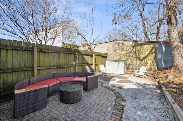 view of patio featuring a fenced backyard and an outdoor living space