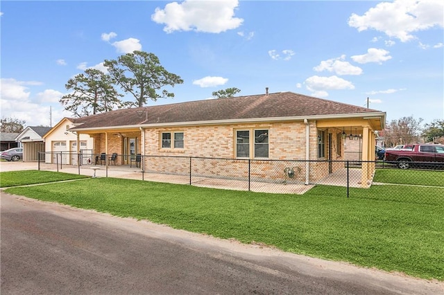 ranch-style house featuring brick siding, a shingled roof, concrete driveway, fence, and a front lawn