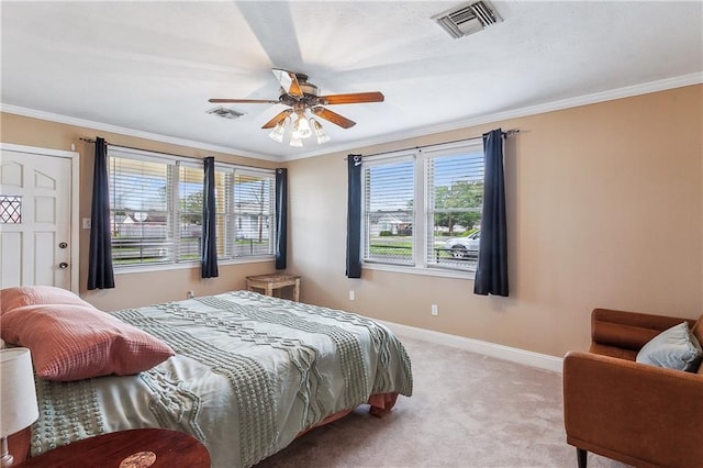 carpeted bedroom with ornamental molding, visible vents, and baseboards