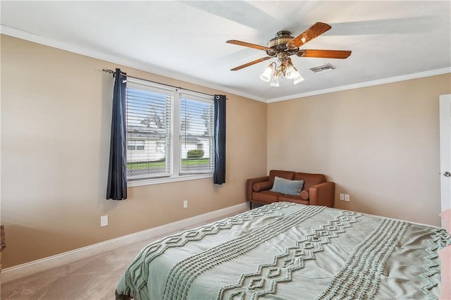 carpeted bedroom featuring ornamental molding, visible vents, ceiling fan, and baseboards