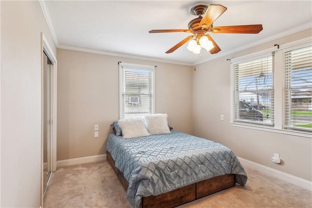 bedroom featuring baseboards, carpet floors, a closet, and crown molding