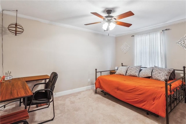 carpeted bedroom with ornamental molding, a ceiling fan, and baseboards