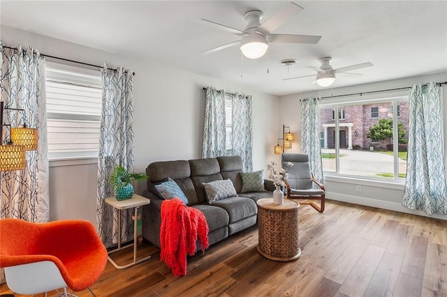 sitting room featuring wood finished floors, visible vents, and baseboards