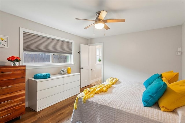 bedroom with ceiling fan and wood finished floors