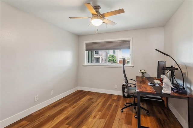 office area featuring ceiling fan, wood finished floors, and baseboards