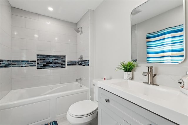 full bath featuring shower / washtub combination, vanity, and toilet