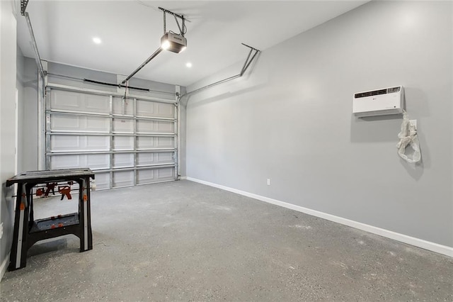 garage featuring a garage door opener and baseboards