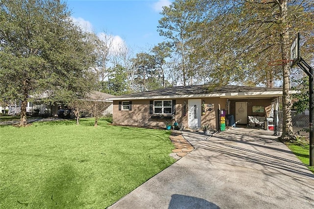 single story home with concrete driveway and a front lawn