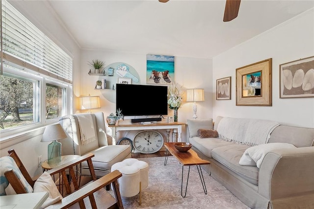 living room with crown molding and wood finished floors